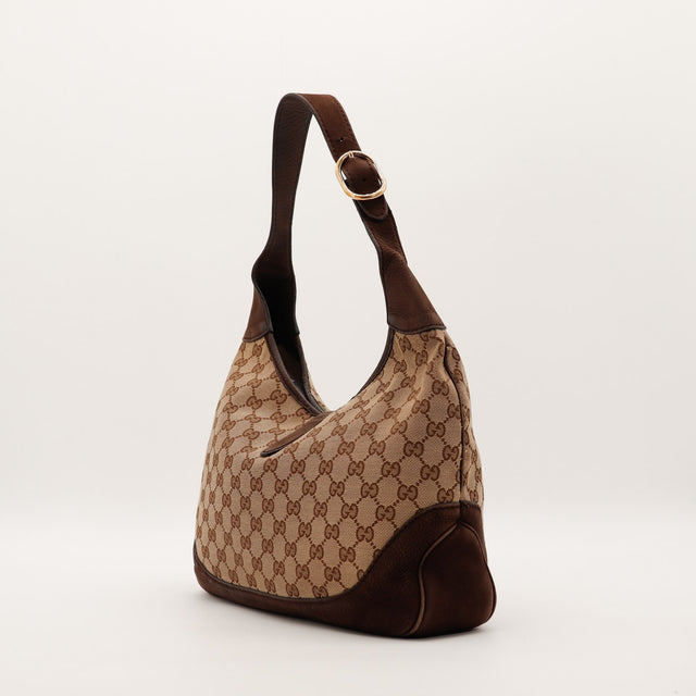 Vue de profil gauche Gucci New Jackie cuir grainé marron coins inférieurs — AMANA Vintage