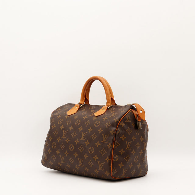 Détail cuir vachette patine caramel Louis Vuitton Speedy 30 occasion authentique — AMANA Vintage