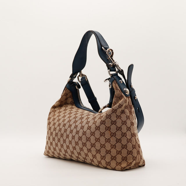 Hobo Gucci toile monogrammée vue de trois quarts gauche détail anse marine — AMANA Vintage
