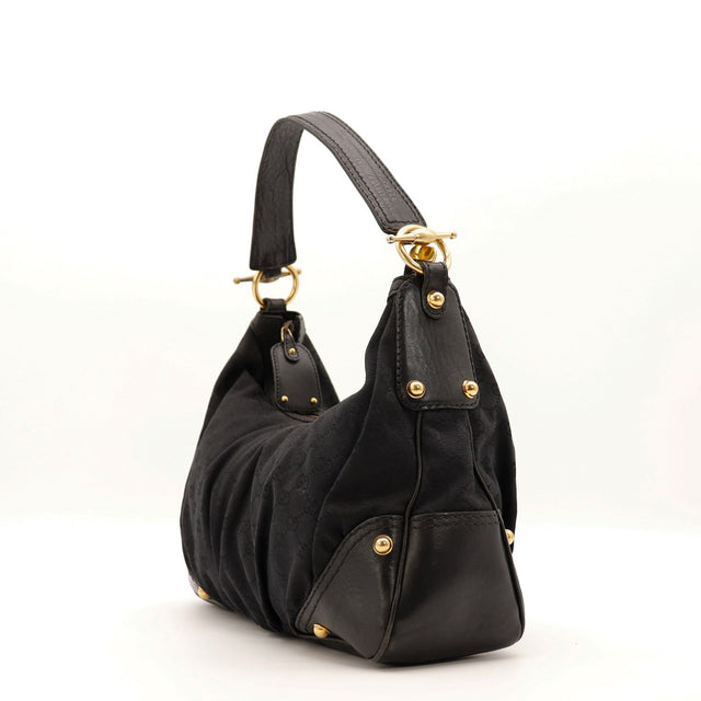 Vue de côté Gucci Indy Hobo noir rivets dorés — AMANA Vintage