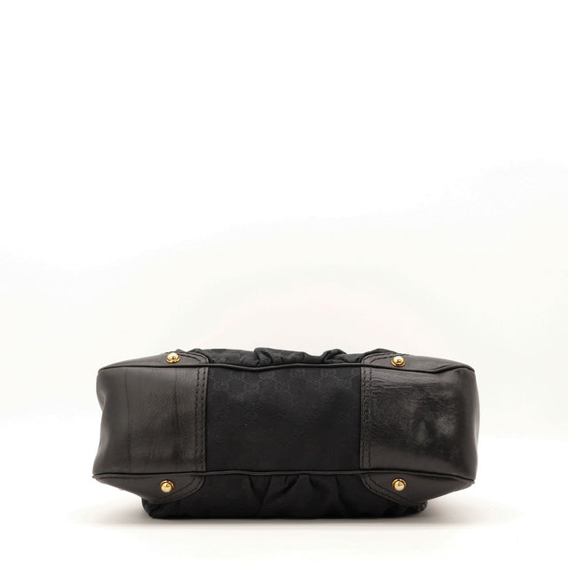 Vue du fond Gucci Indy Hobo noir pieds dorés — AMANA Vintage