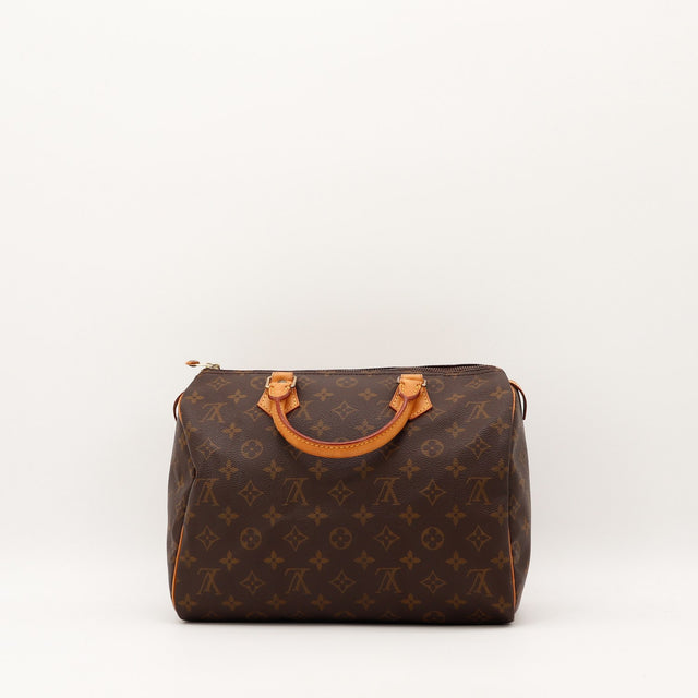 Détail anses cuir vachette patine caramel Louis Vuitton Speedy 30 — AMANA Vintage