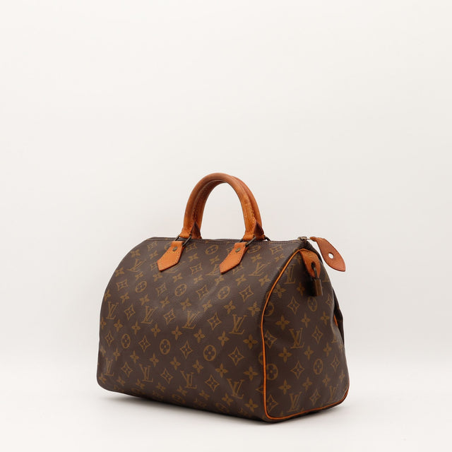 Détail cuir vachette patine caramel Louis Vuitton Speedy 30 — AMANA Vintage