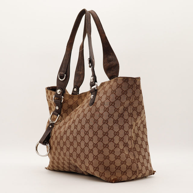 Vue de trois quarts Gucci Tote Horsebit toile monogramme cuir marron — AMANA Vintage