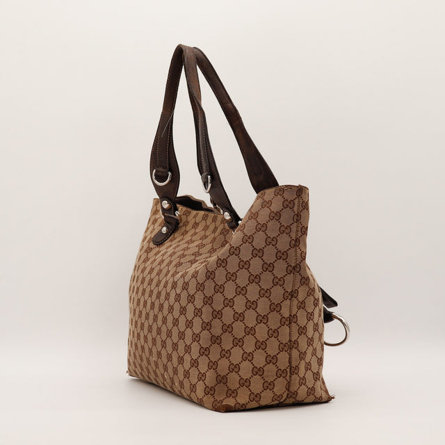 Vue de trois quarts dos Gucci Tote Horsebit cuir usé anses — AMANA Vintage