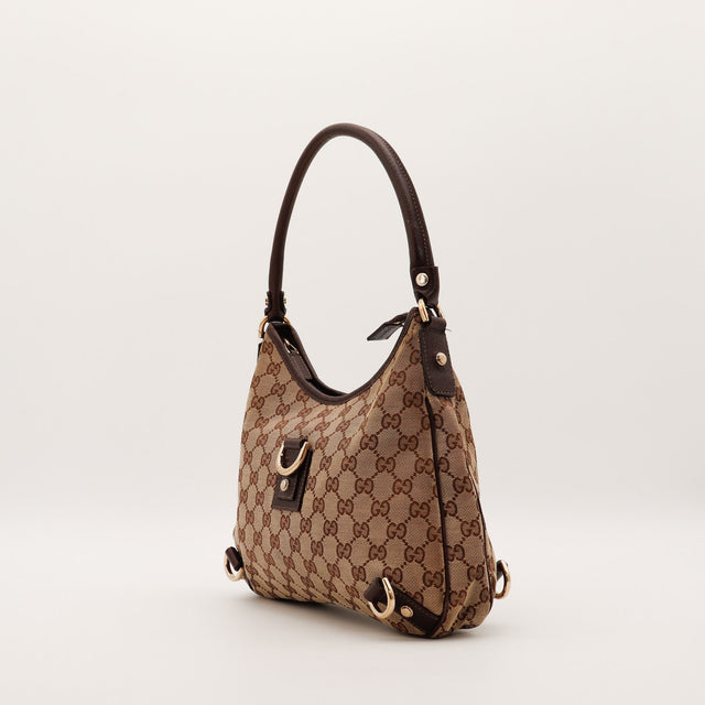 Vue de trois quarts Gucci Hobo D-Ring toile monogrammée cuir marron — AMANA Vintage