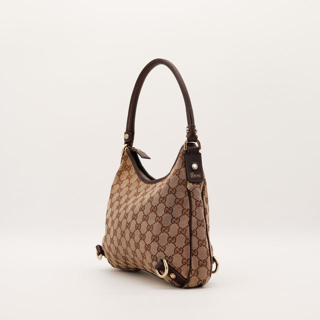 Vue de profil Gucci Hobo D-Ring toile monogrammée cuir chocolat — AMANA Vintage