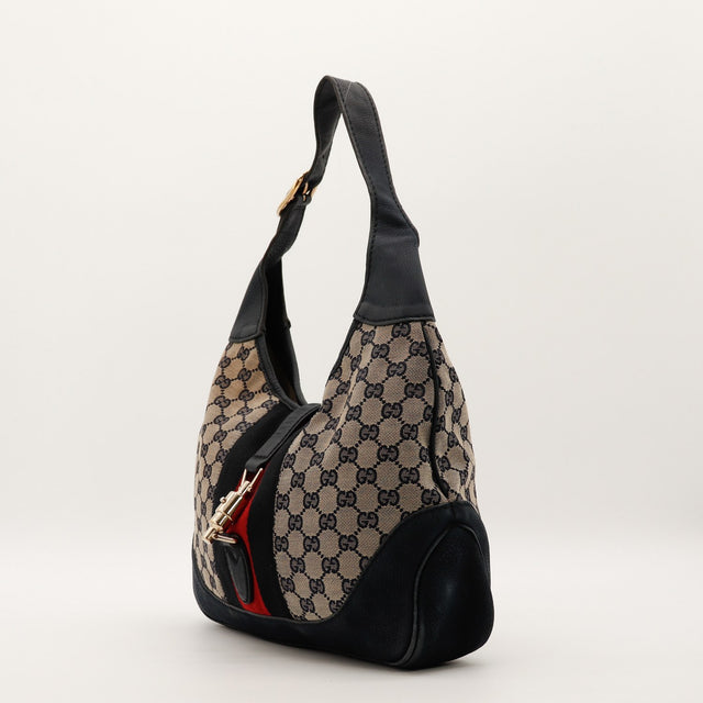 Vue de profil Gucci New Jackie toile monogrammée cuir noir bande Web tricolore — AMANA Vintage