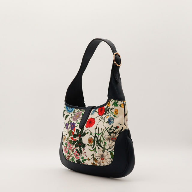 Vue de profil Gucci Jackie Flora silhouette hobo demi-lune — AMANA Vintage