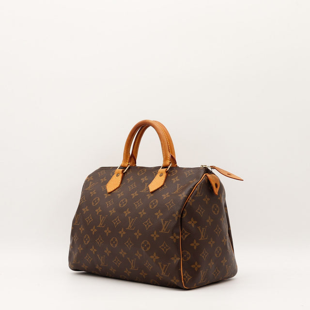 Détail anses cuir vachette patine caramel Louis Vuitton Speedy 30 — AMANA Vintage