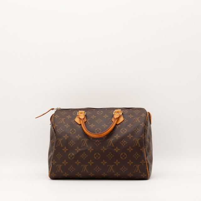 Détail coins et tranches vachette Louis Vuitton Speedy 30 occasion — AMANA Vintage