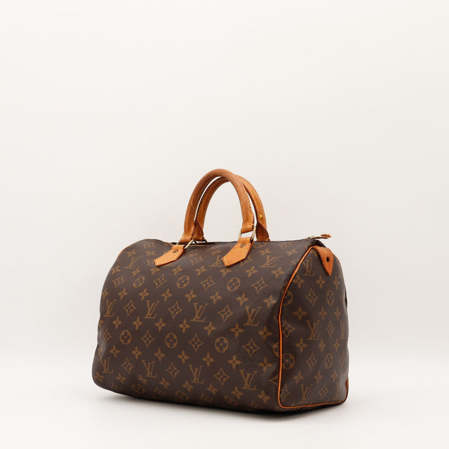 Détail cuir vachette patine caramel anses Louis Vuitton Speedy 30 — AMANA Vintage