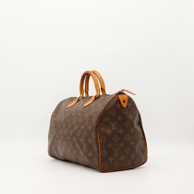 Louis Vuitton Speedy 35 vue trois quarts anses vachette patine caramel — AMANA Vintage