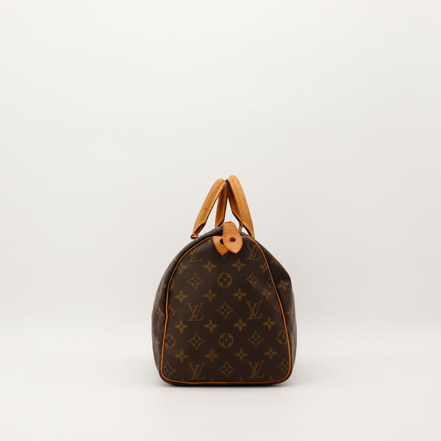 Louis Vuitton Speedy 30 vue de profil gauche toile Monogram cuir vachette patine caramel — AMANA Vintage