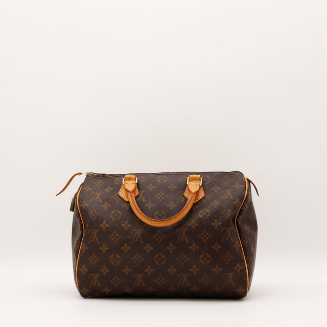 Détail anses en cuir vachette patine caramel Louis Vuitton Speedy 30 — AMANA Vintage
