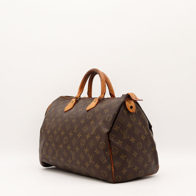 Detail anses cuir vachette patine sombre Louis Vuitton Speedy 35 — AMANA Vintage