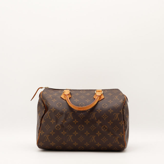 Détail anses cuir vachette patine caramel Louis Vuitton Speedy 30 — AMANA Vintage