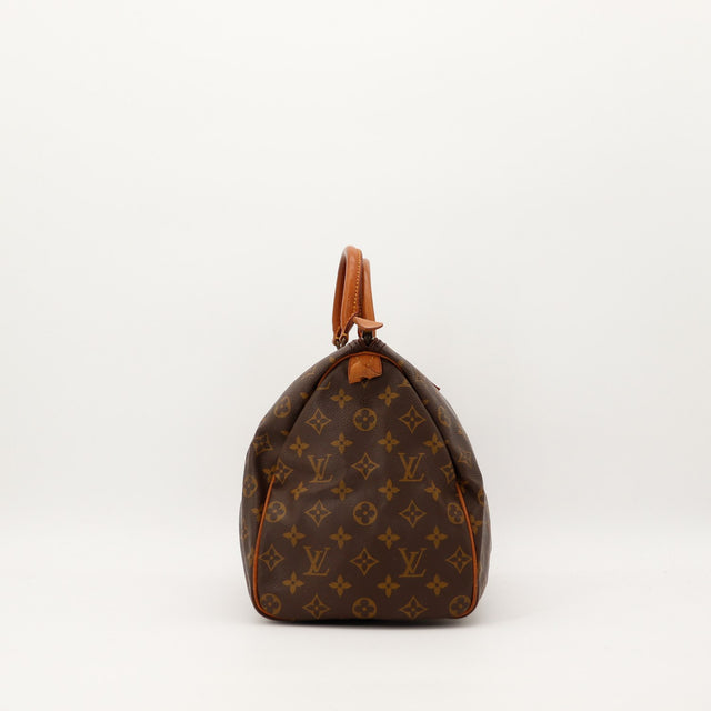 Louis Vuitton Speedy 35 vue de profil gauche toile Monogram patine caramel — AMANA Vintage