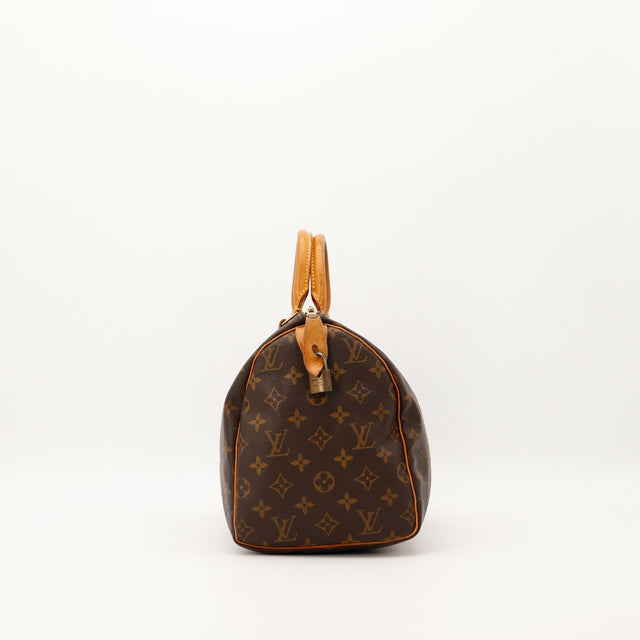 Louis Vuitton Speedy 30 vue de profil gauche patine caramel occasion — AMANA Vintage