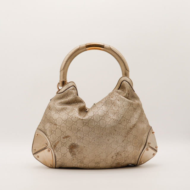 Gucci Indy Hobo vue de dos taches visibles sur le cuir monogrammé — AMANA Vintage