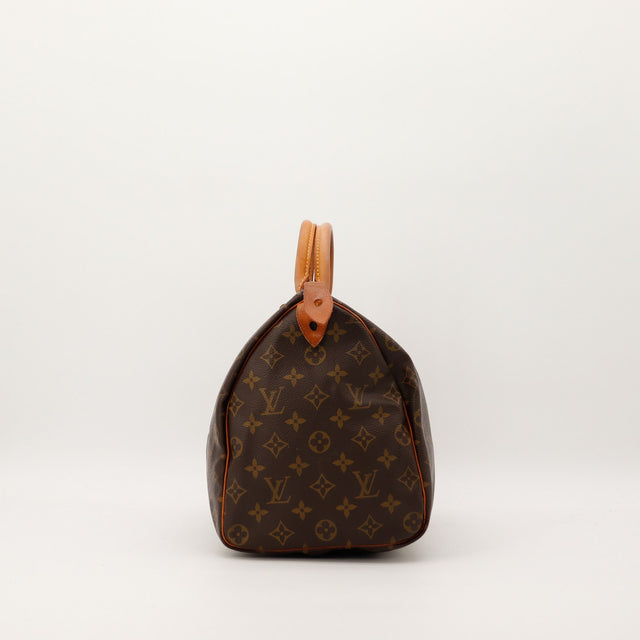 Vue de profil Louis Vuitton Speedy 35 toile Monogram patine caramel — AMANA Vintage