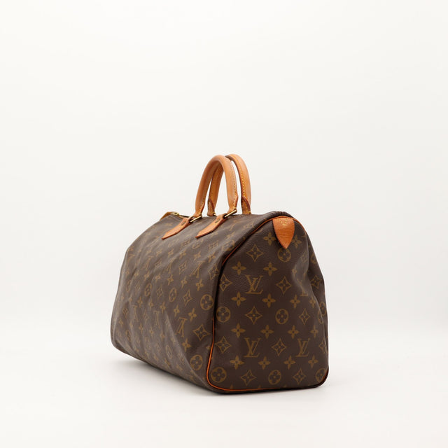 Detail anse et tab vachette Louis Vuitton Speedy 35 patine caramel — AMANA Vintage