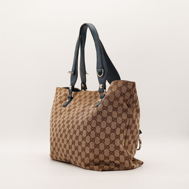 Tote Bag Gucci vue de trois quarts droit anses cuir bleu marine — AMANA Vintage