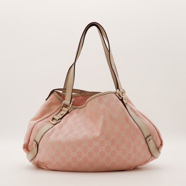 Sac Gucci Hobo toile monogrammée rose poudré cuir beige vue de profil occasion authentique — AMANA Vintage