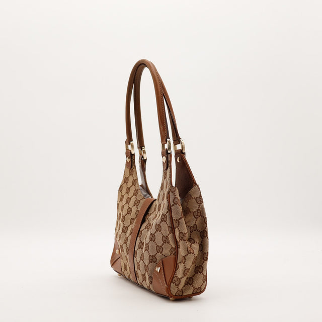 Profil droit Gucci New Jackie cuir marron détail anses — AMANA Vintage