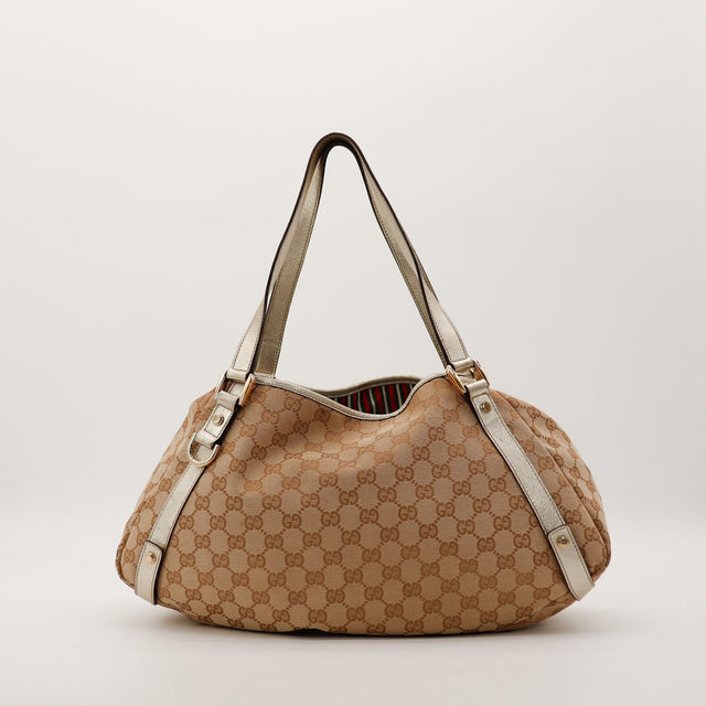 Sac Gucci Hobo toile GG canvas cuir métallisé doré vue de face occasion authentique — AMANA Vintage