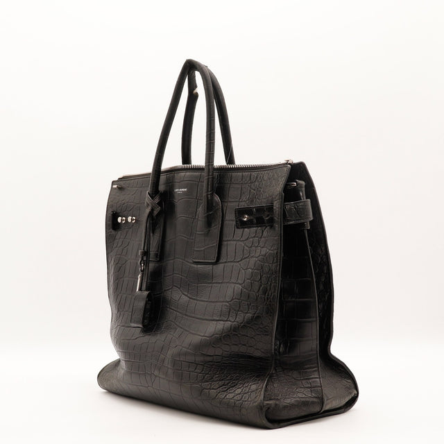 Vue de trois quarts Saint Laurent Sac de Jour Souple cuir embossé façon crocodile noir occasion authentique — AMANA Vintage