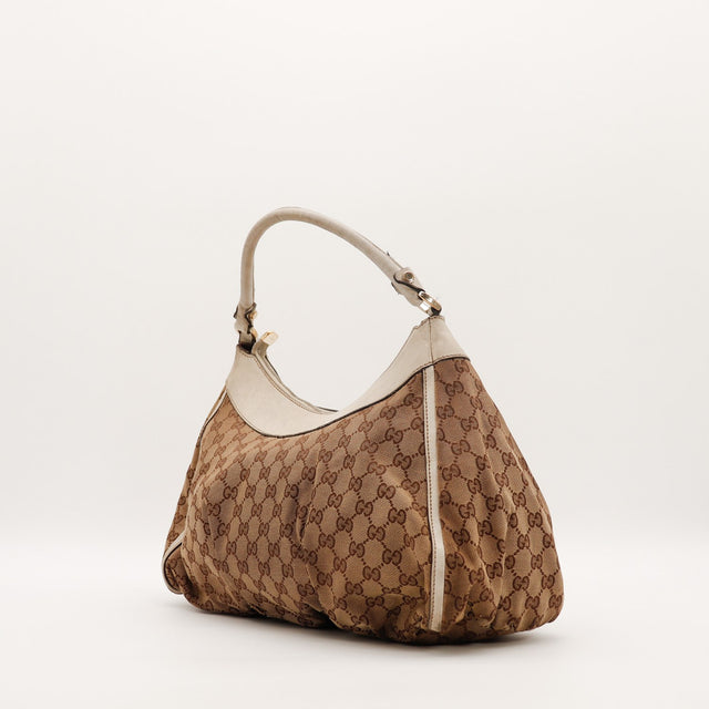 Hobo Gucci vue de trois quarts côté gauche cuir ivoire anse — AMANA Vintage