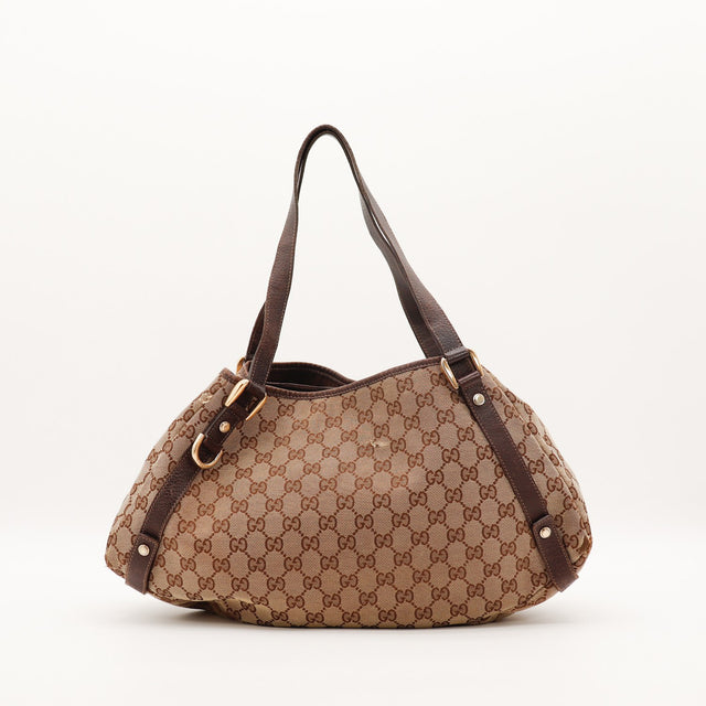Vue de trois quarts arrière Gucci Hobo toile monogrammée D-rings dorés — AMANA Vintage