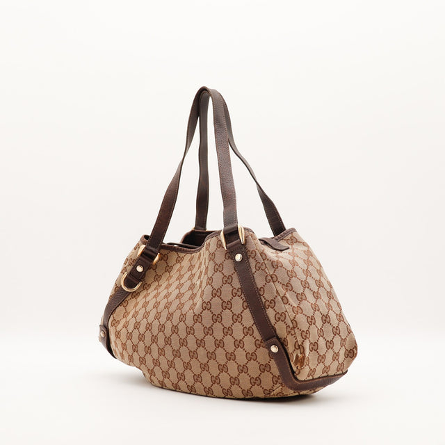 Vue latérale sac Gucci Hobo toile monogrammée cuir marron foncé — AMANA Vintage