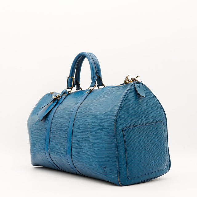 Louis Vuitton Keepall 50 Épi bleu vue trois quarts côté droit occasion — AMANA Vintage