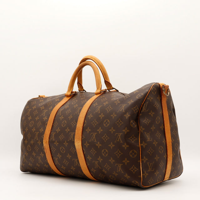 Louis Vuitton Keepall 55 vue de trois quarts angle gauche — AMANA Vintage