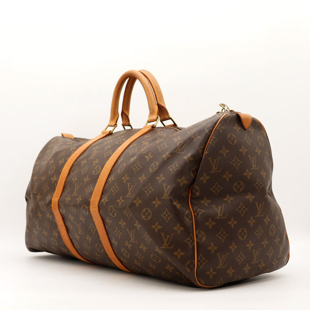 Louis Vuitton Keepall 55 vue de trois quarts toile Monogramme cuir vachette — AMANA Vintage