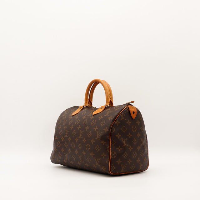Vue de trois quarts Louis Vuitton Speedy 30 toile Monogram patine caramel — AMANA Vintage