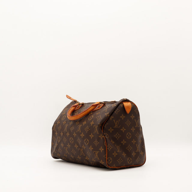 Louis Vuitton Speedy 35 vue trois quarts dos patine caramel — AMANA Vintage