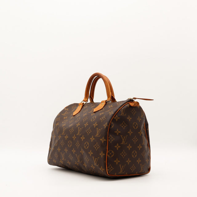 Louis Vuitton Speedy 30 vue trois quarts droite toile monogram patine caramel — AMANA Vintage