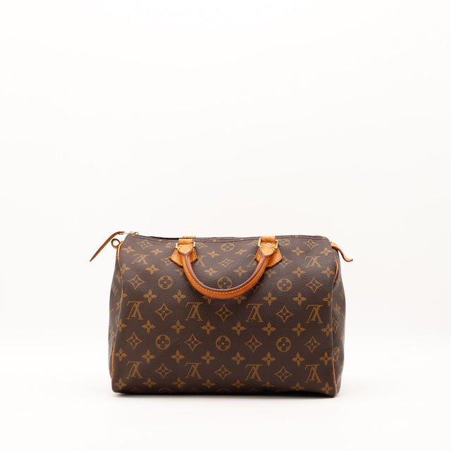Louis Vuitton Speedy 30 vue de face sac posé patine vachette caramel — AMANA Vintage