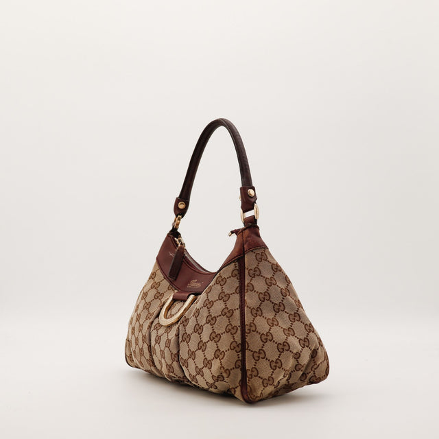 Sac Gucci Hobo toile monogrammée vue de profil occasion authentique — AMANA Vintage