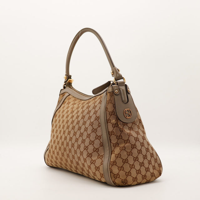 Sac Gucci Hobo toile monogrammée vue de trois quarts occasion authentique — AMANA Vintage