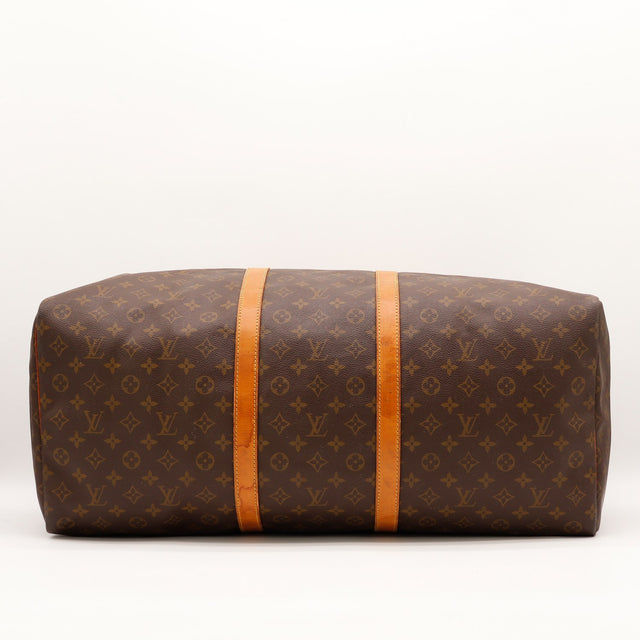 Détail de la fermeture dorée Louis Vuitton Keepall 55 — AMANA Vintage