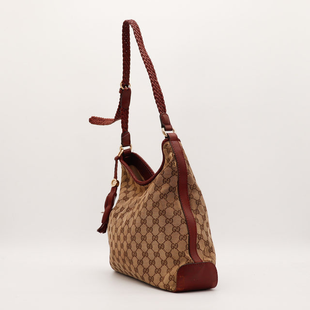Sac Gucci Hobo vue de profil toile monogrammée cuir bordeaux occasion authentique — AMANA Vintage