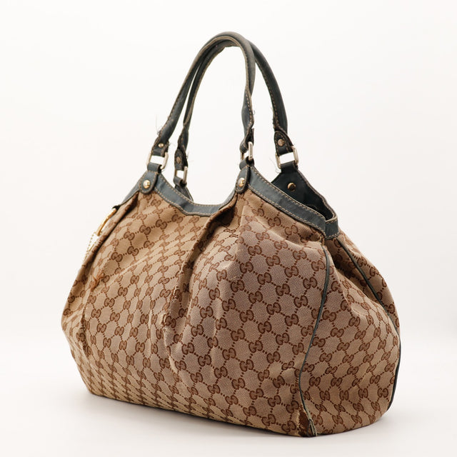 Sac Gucci Sukey toile monogrammée vue de trois quarts occasion authentique — AMANA Vintage