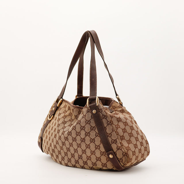 Détail anses cuir Gucci Hobo toile monogrammée occasion authentique — AMANA Vintage