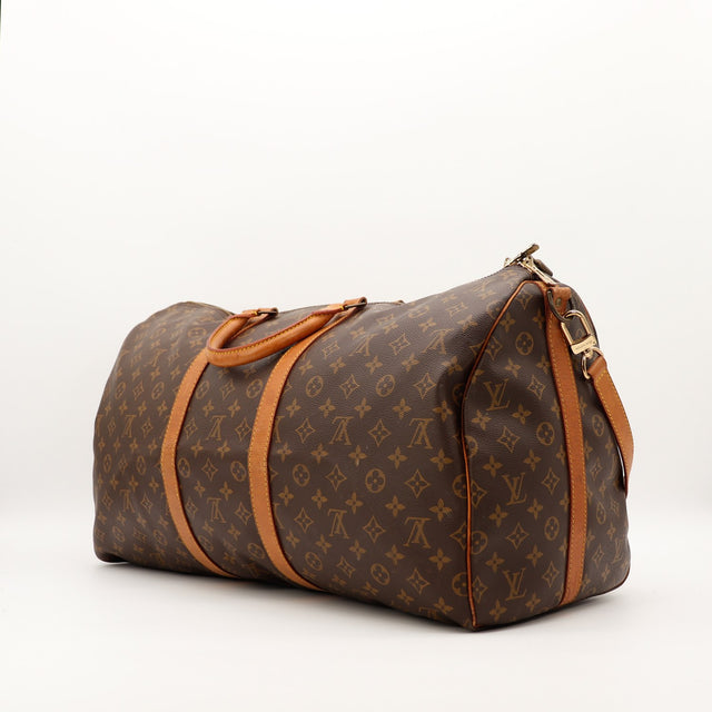 Louis Vuitton Keepall 55 vue de côté cuir vachette patiné occasion authentique — AMANA Vintage