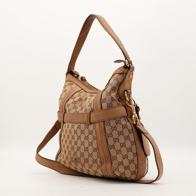 Sac Gucci Hobo GG profil détail garnitures cuir occasion authentique — AMANA Vintage