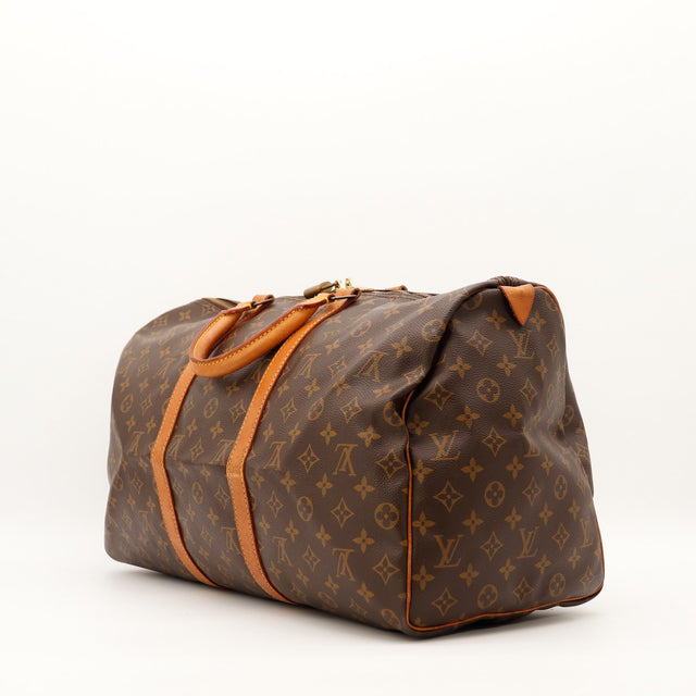 Louis Vuitton Keepall 50 vue latérale et anses cuir vachette occasion authentique — AMANA Vintage